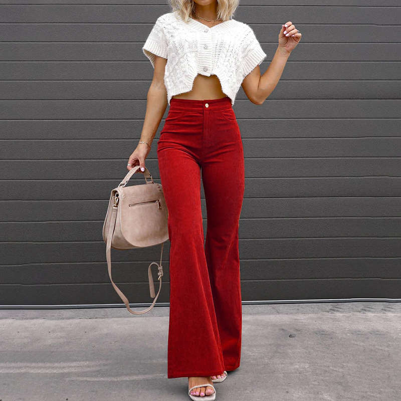 Versatile women's high-waisted flared pants with ribbed fabric, perfect for creating retro-inspired looks.