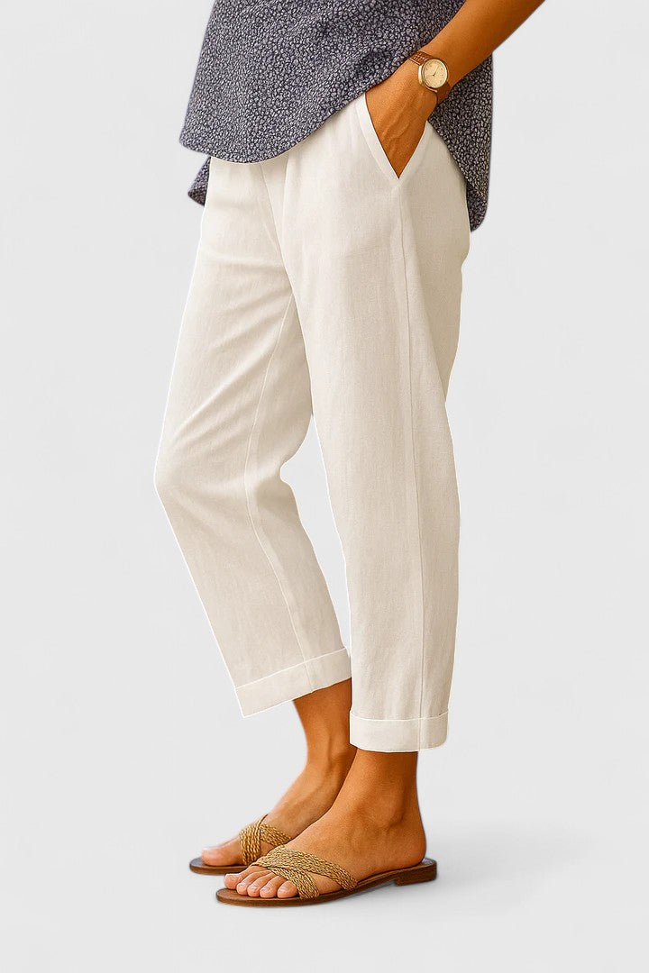 Close-up of the tailored cuff and straight leg design on women's versatile ankle pants, highlighting elegant detail.