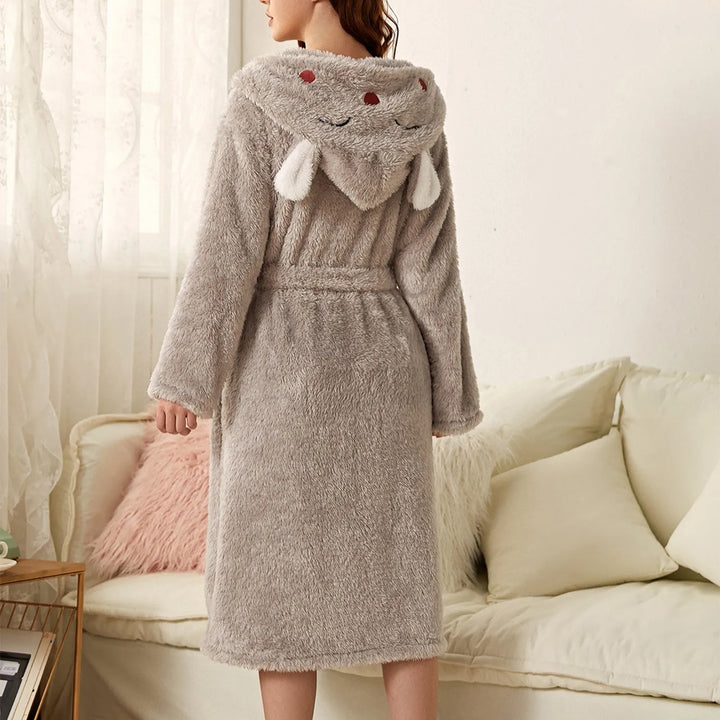 Cute women's hooded bunny ear robe. Soft flannel loungewear, ideal for relaxing at home or after a bath.