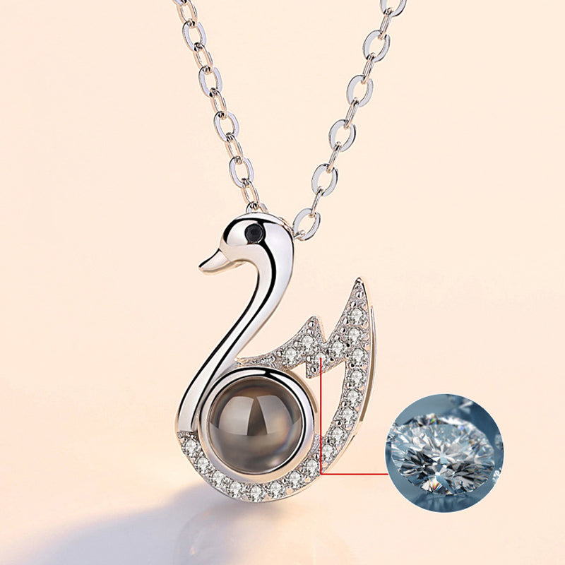 Elegant silver 'I Love You' necklace for women, 100 languages projection, ideal anniversary gift.