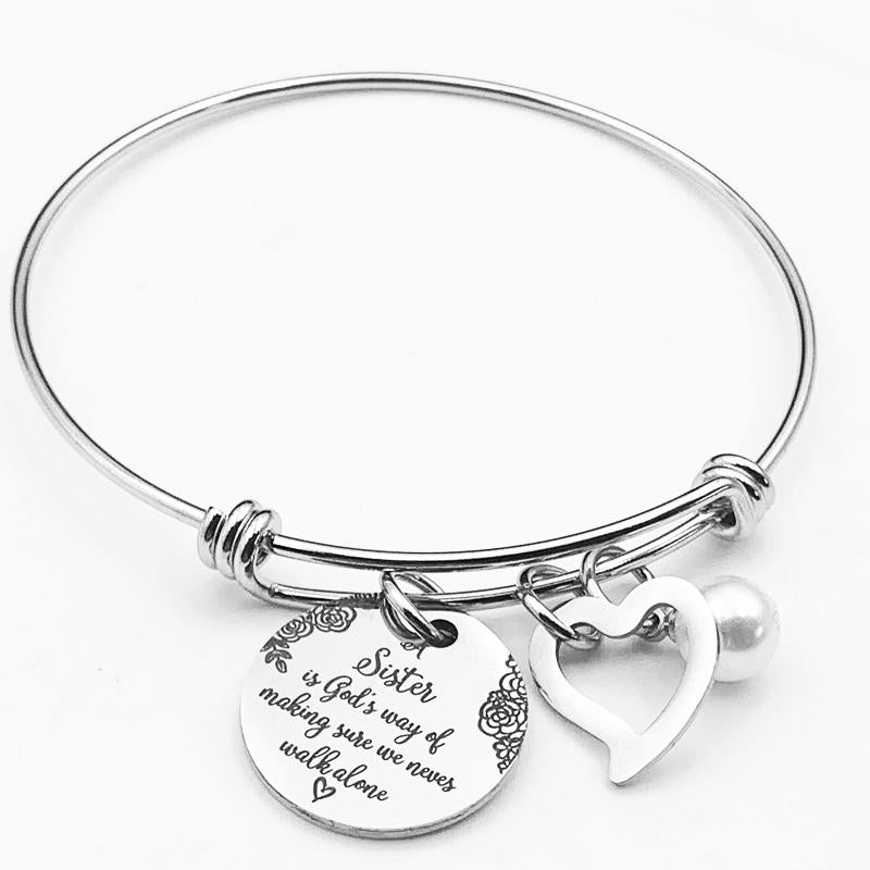 Detail view of the polished stainless steel and engraving on sister bangle jewelry