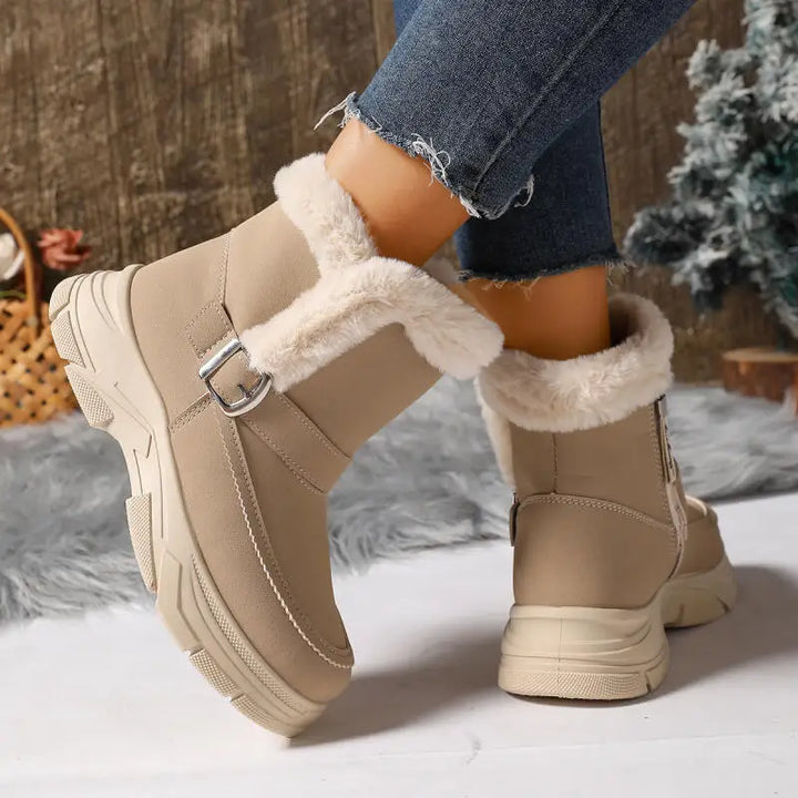 Sole view of women's winter boots, highlighting shock-absorbing orthopedic design