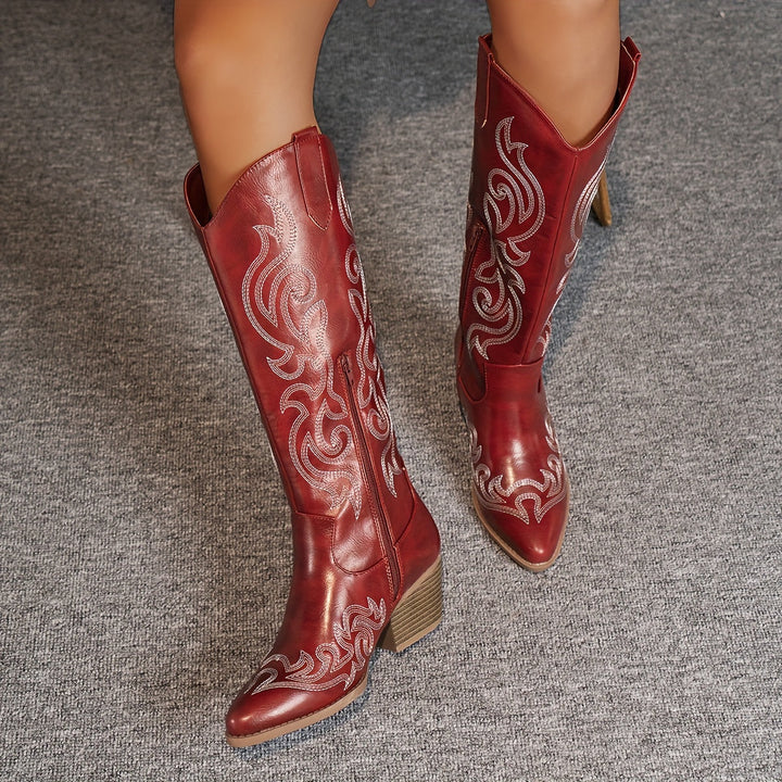 Brown embroidered women's cowboy boots. Knee-high western style with comfortable block heel.