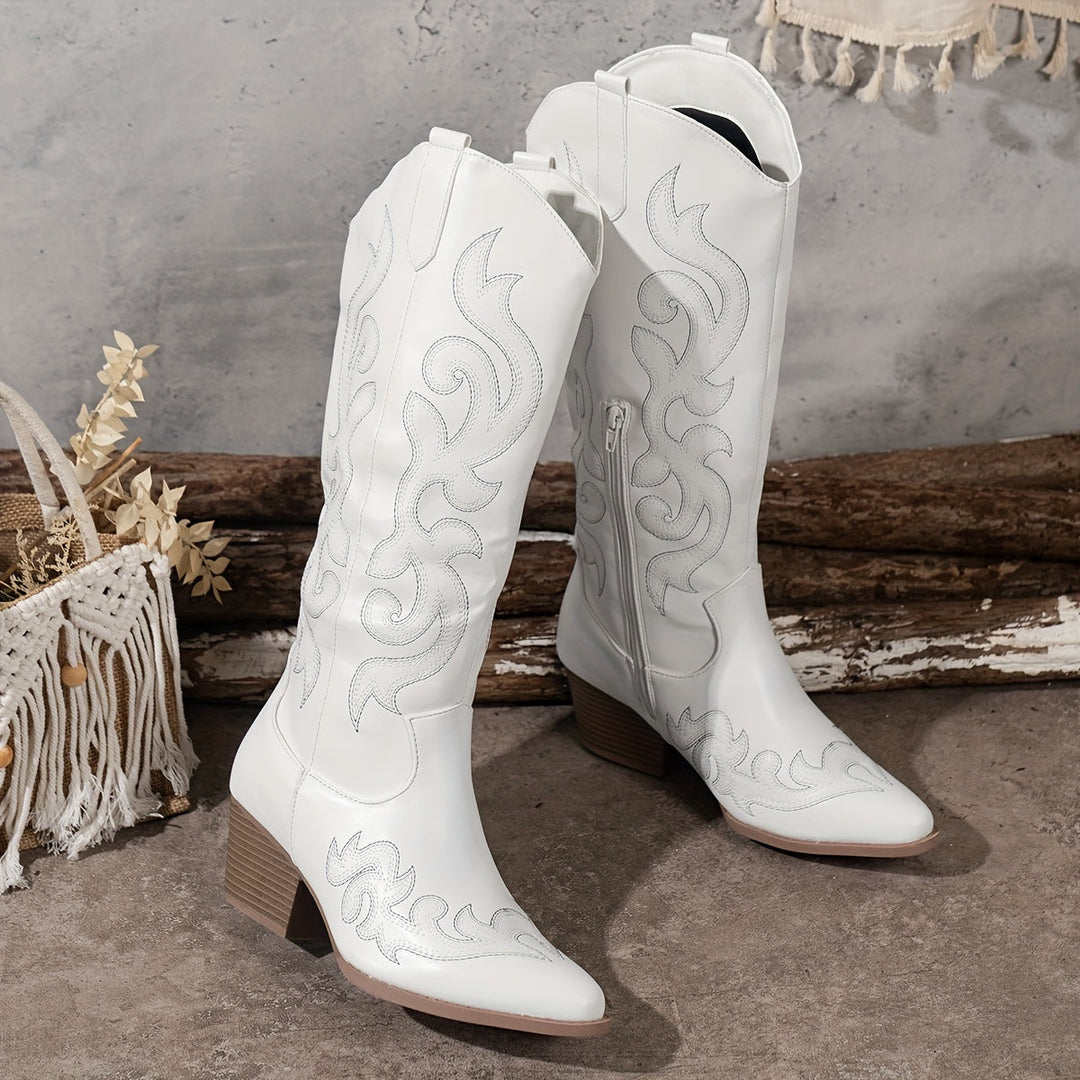 Women's western footwear. Knee-high black cowboy boots with block heel and embroidery.