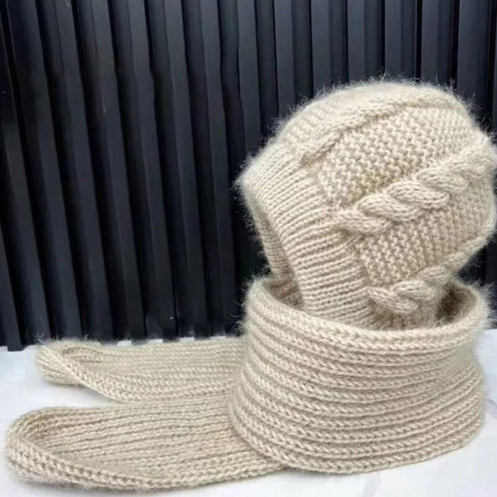 Woman wearing a stylish knit beanie and matching scarf, perfect for casual winter outings