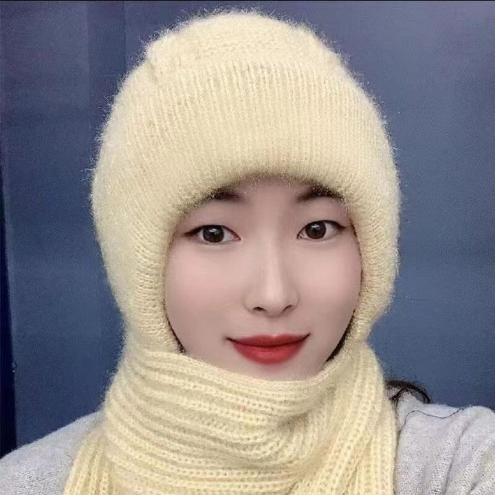Model wearing the women's knit beanie and scarf set in a snowy outdoor setting