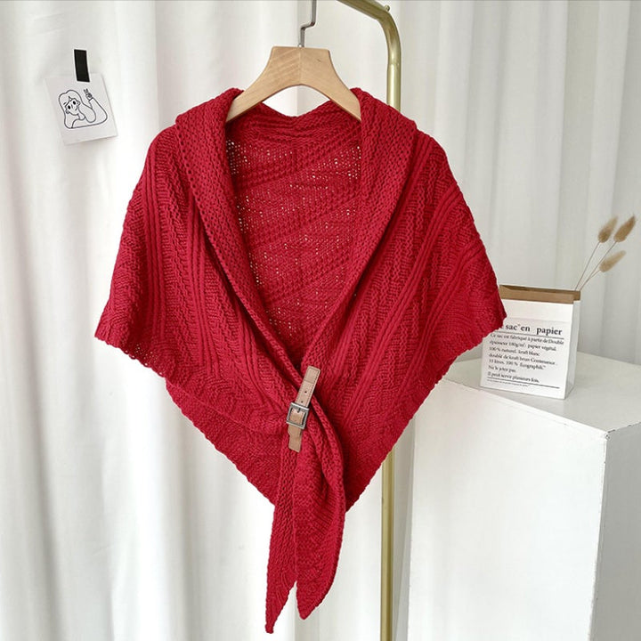 Elegant black knitted triangle shawl with unique buckle, a timeless accessory