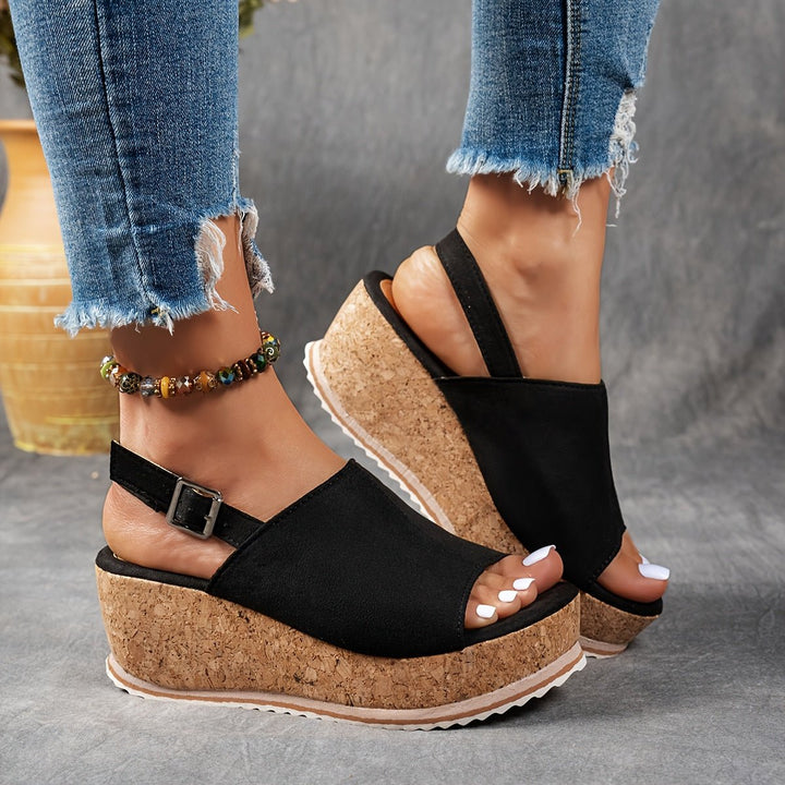 Stylish women's open-toe leopard print platform wedge sandals, featuring a comfortable design and buckle strap.