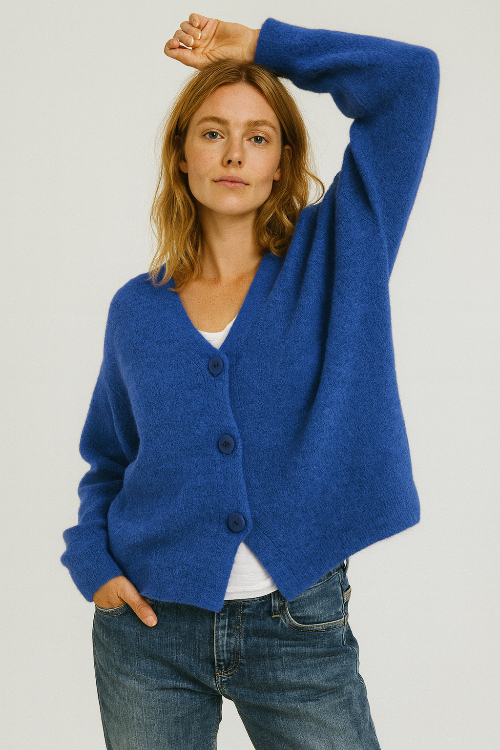 Casual women's short-sleeve button-front cardigan in soft pink, perfect for spring and summer outfits.