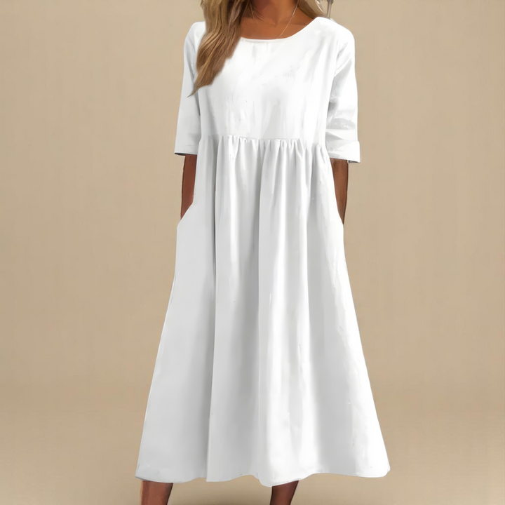 Versatile women's flowy summer dress, suitable for casual outings, travel, and comfortable spring fashion.