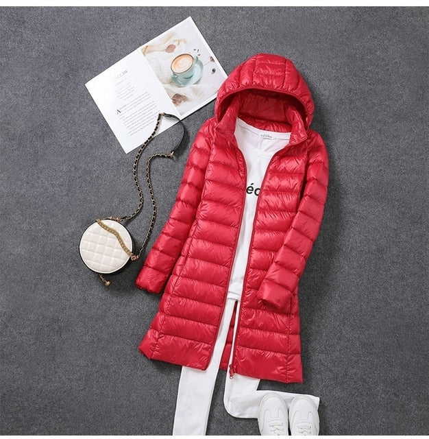 Warm women's long puffer winter coat, windproof and water resistant, ideal for cold weather outerwear.