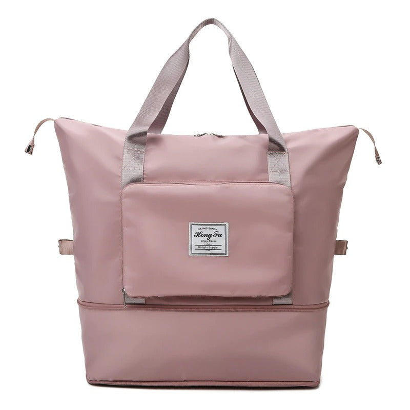 Waterproof weekender travel bag for women, lightweight & expandable. Protects essentials from rain, ideal carry-on.