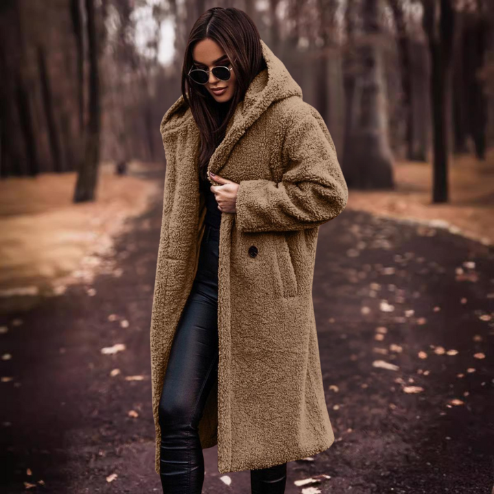 Fluffy long hooded teddy bear coat for women, ideal for a warm and chic winter outerwear statement.