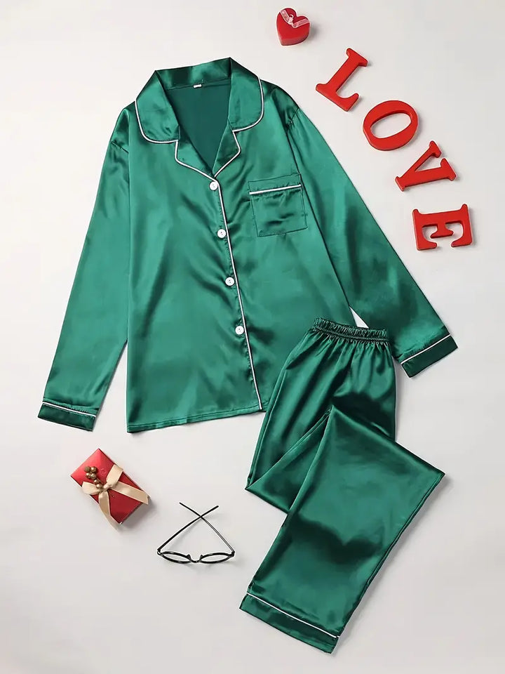 Soft women's satin sleepwear set, featuring a button-up top and matching pants, ideal for lounging.