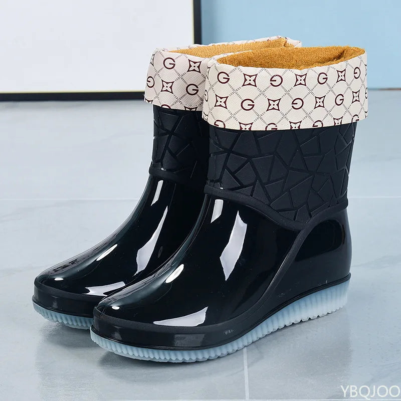 Mid-height ladies rain boots, patterned design, waterproof for superior wet weather protection.