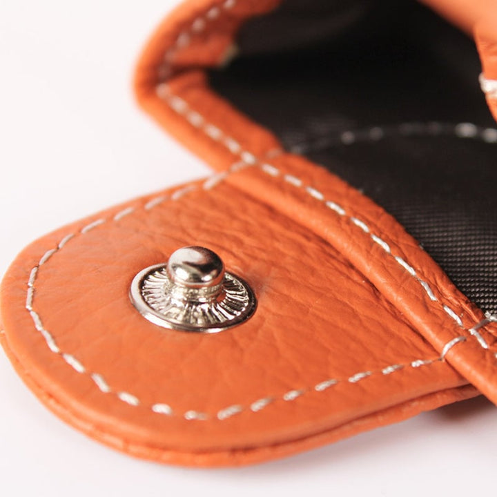 Open mini pink leather coin purse showing interior, perfect for small change