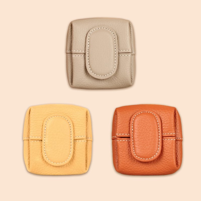 Women's compact orange leather coin purse, a bold and stylish fashion statement