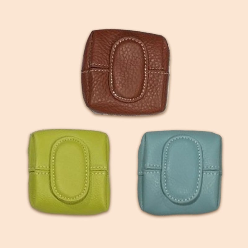 Mini green leather coin purse with a secure snap closure, alternative design