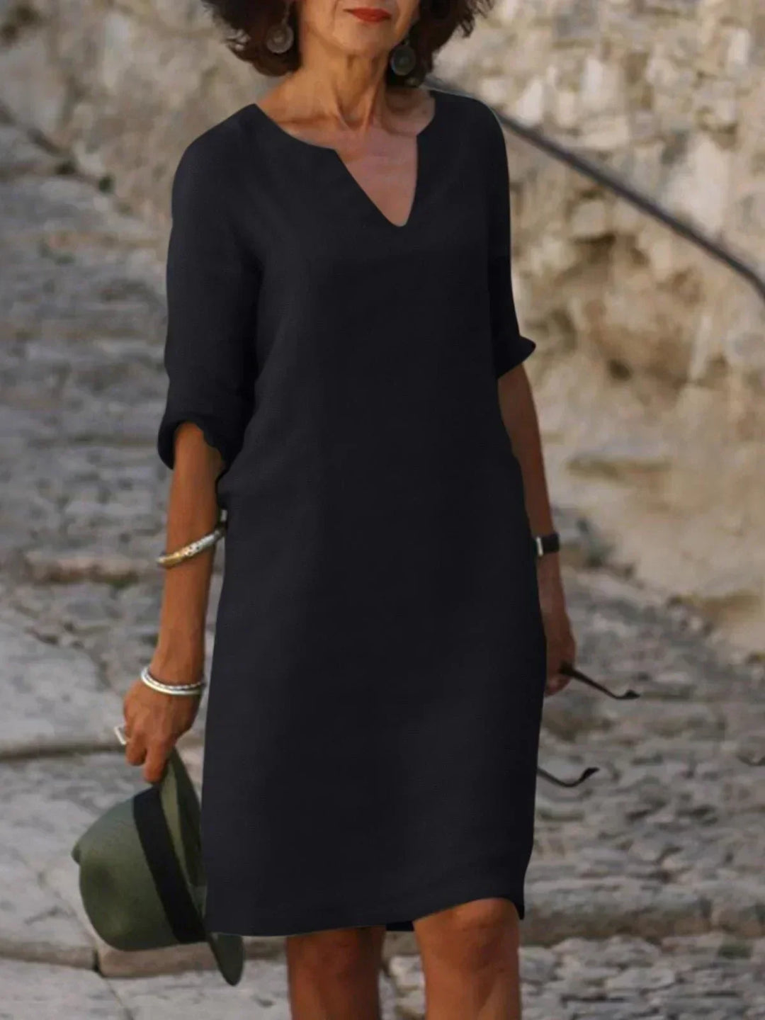 Loose fit women's mini dress with 3/4 sleeves & V-neck, ideal for versatile summer style.