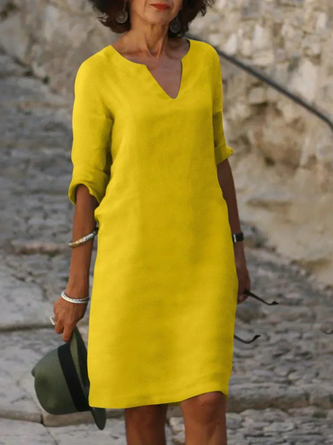 Women's stylish mini dress, featuring a V-neck, 3/4 sleeves, and a comfortable loose fit.