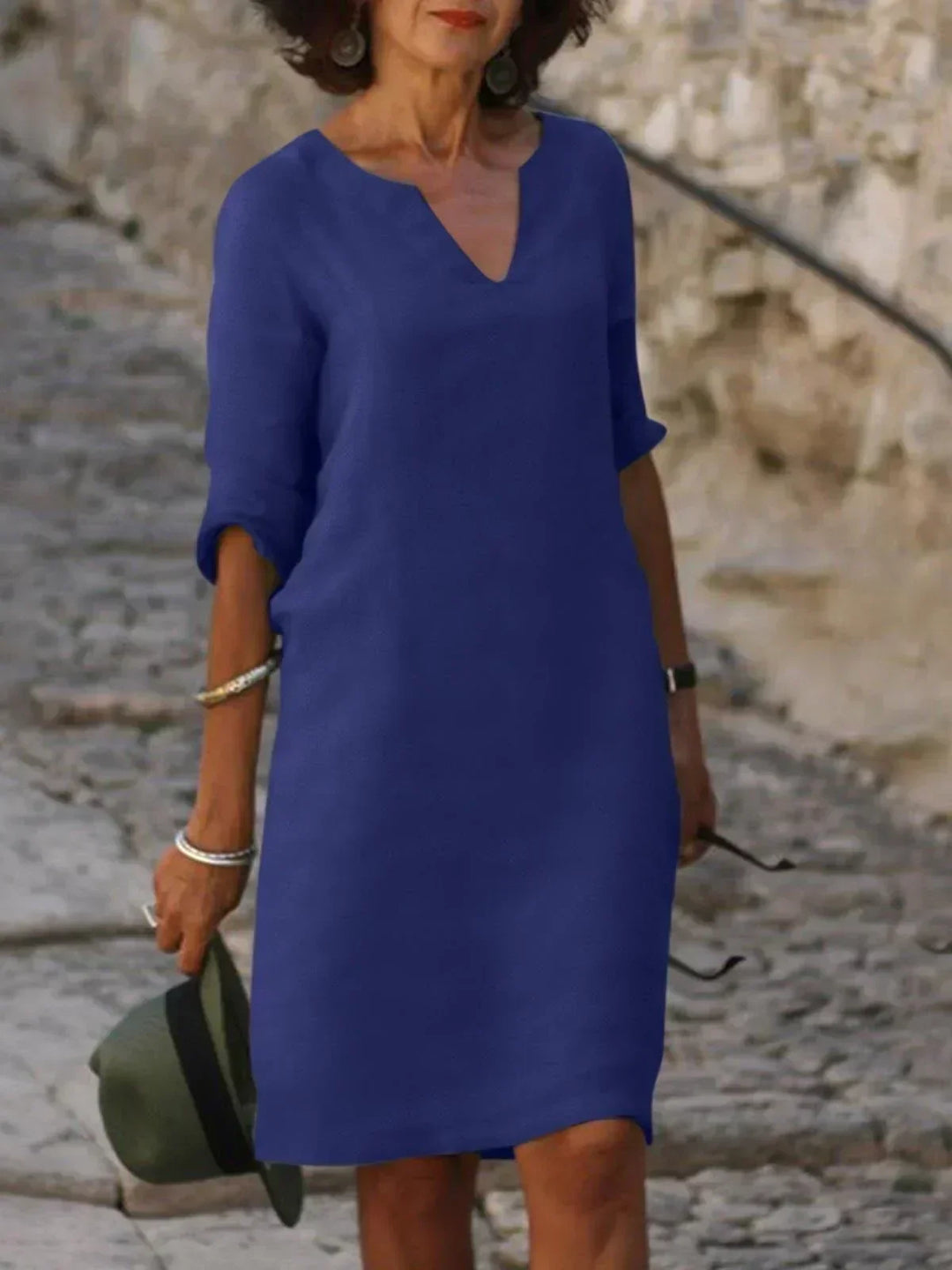 Chic summer mini dress for women with a flattering V-neck and practical 3/4 sleeves.