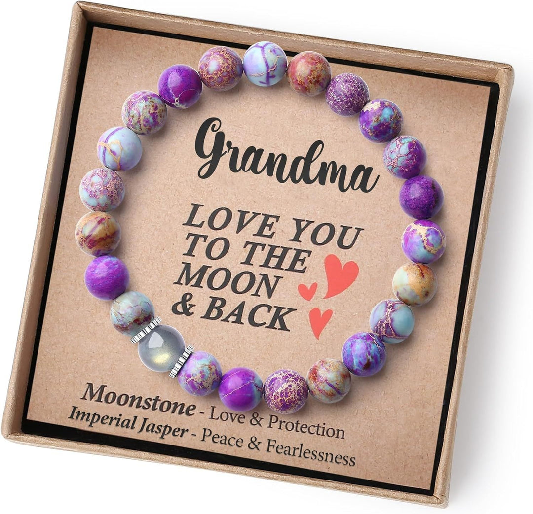 Close-up of women's crystal healing bracelet with moonstone and jasper beads