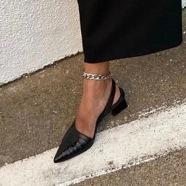 Fashionable women's orthopedic block heels with a sleek pointed toe. Comfortable slingback design for stylish daily wear.