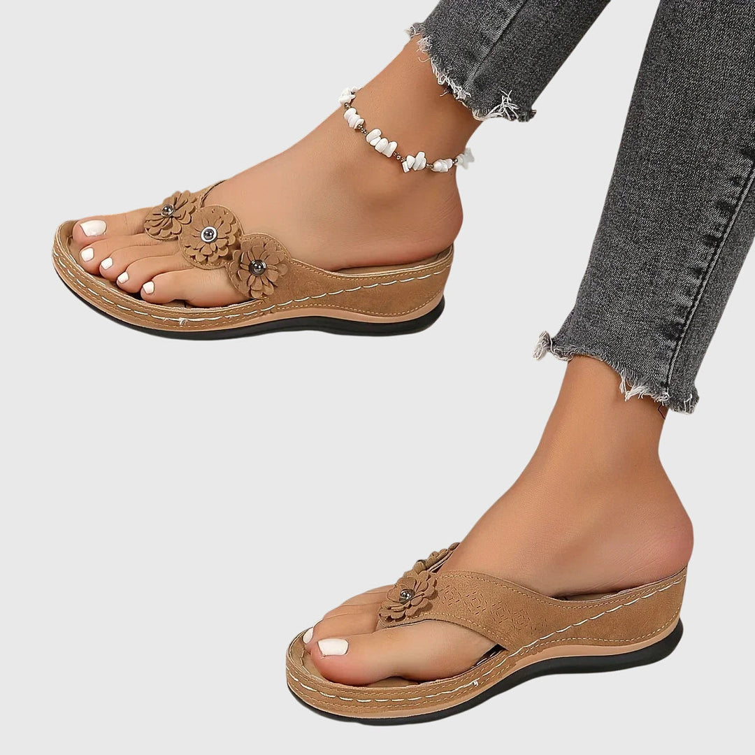 Casual women's orthopedic footwear: comfortable flip flops with strong arch support for active summer days.