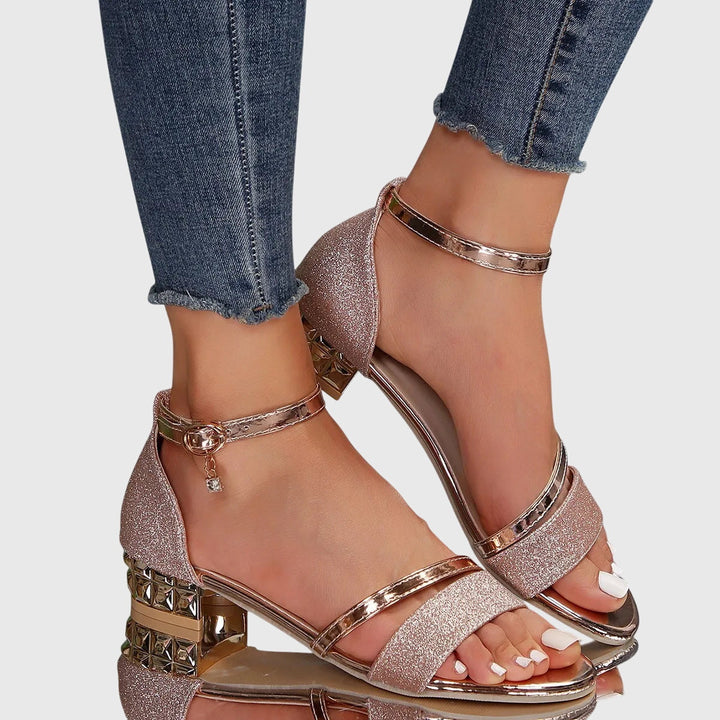 Dressy women's heeled sandals with adjustable strap & ergonomic foot support for comfort.