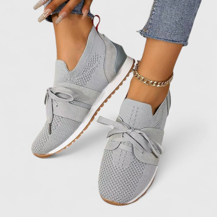 Casual women's slip-on walking sneakers with elasticized opening for easy wear and comfortable support.