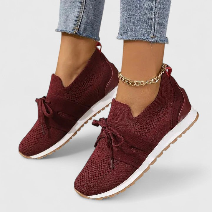 Supportive women's orthopedic walking sneakers featuring a non-slip sole and cushioned footbed.