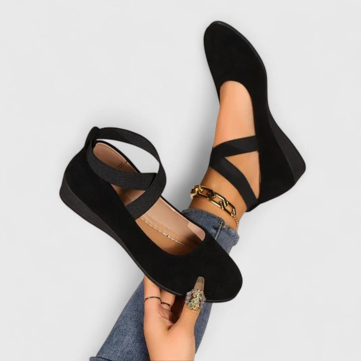 Stylish women's wedge sandals with adjustable cross straps, offering orthopedic comfort & arch support.