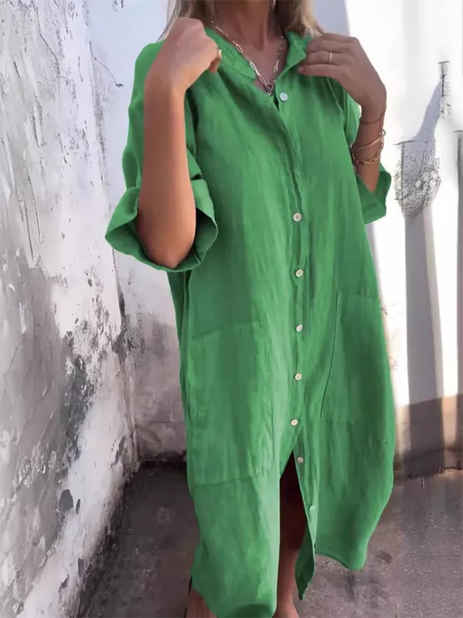 Effortless women's oversized midi button down dress with roll tab sleeves, offering comfort and bohemian style.