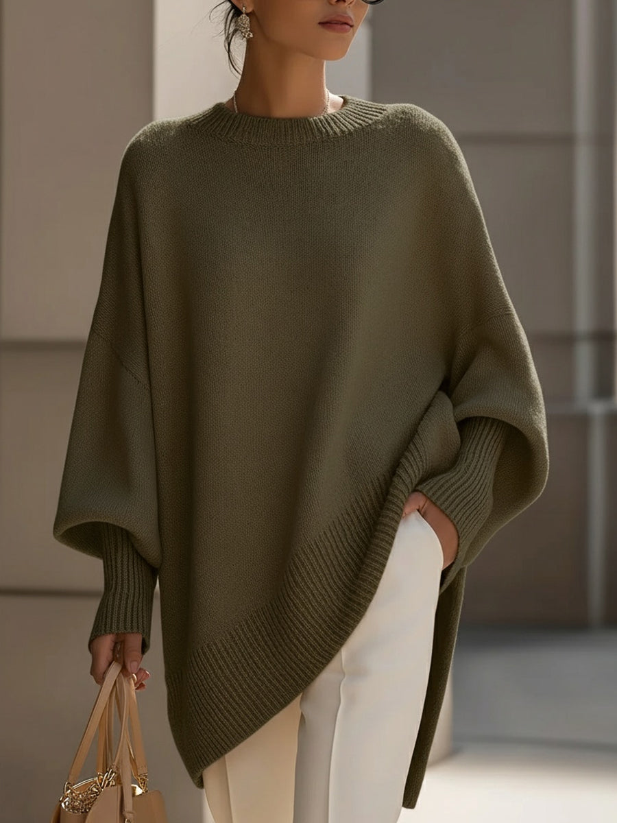 Comfy women's oversized batwing sleeve sweater, a stylish and elegant poncho cape perfect for autumn layering.