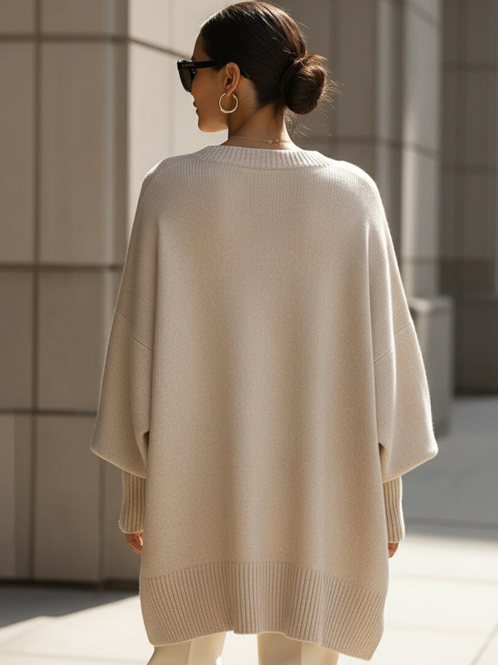 Comfortable women's oversized cape sweater. Elegant poncho style, perfect for versatile autumn layering.