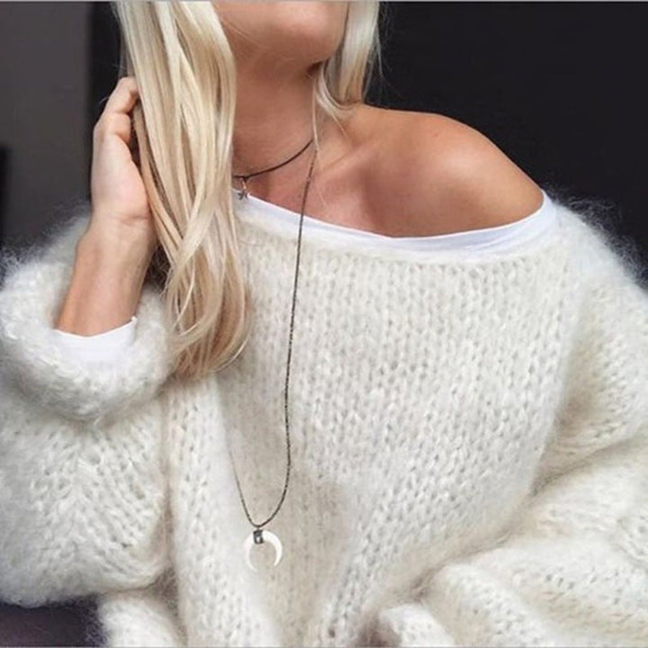 Boho-chic oversized crocheted sweater for women, featuring a trendy knit design for effortless style this fall.