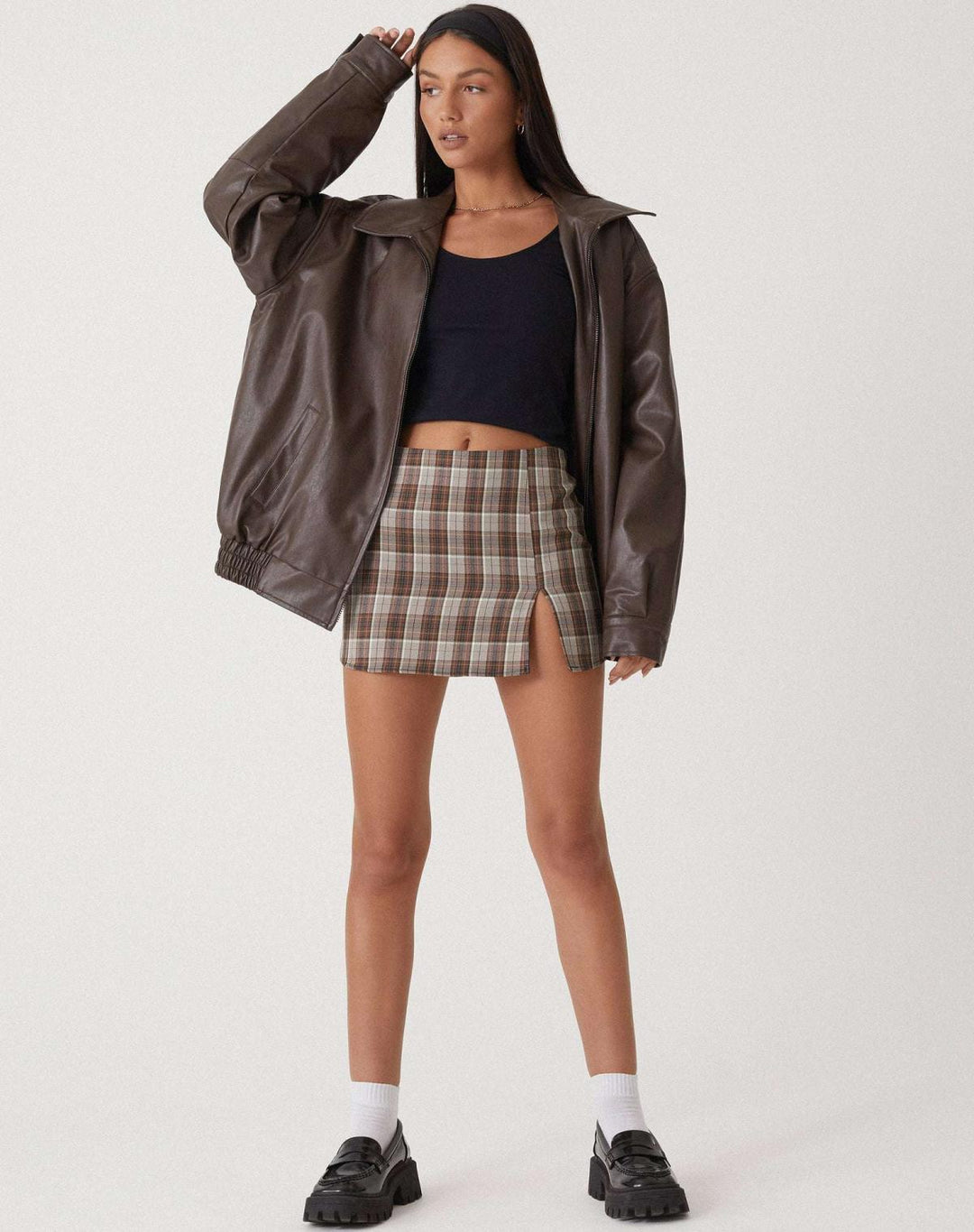 Black oversized faux leather bomber jacket for women, a stylish outerwear piece for urban fashion.