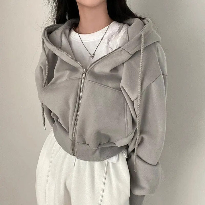 Women's oversized hooded vest, short cut. Casual and comfortable ladies fashion for streetwear layering.