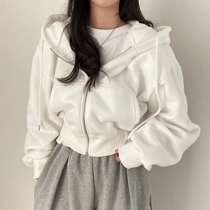 Comfortable women's oversized hooded vest, short cut. Contemporary ladies apparel for casual & streetwear.