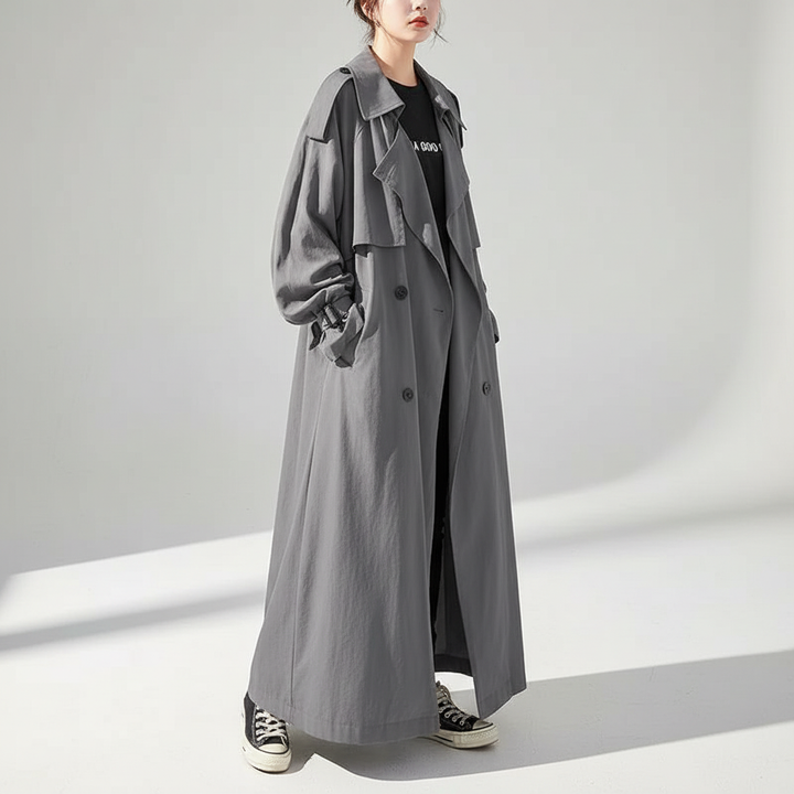 Sophisticated women's oversized full-length trench coat, a chic long jacket for modern fall fashion.