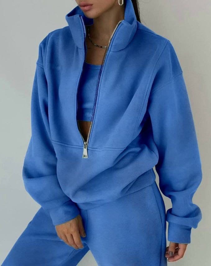 Comfortable women's jogger set featuring an oversized pullover and matching pants for relaxed, stylish lounging.