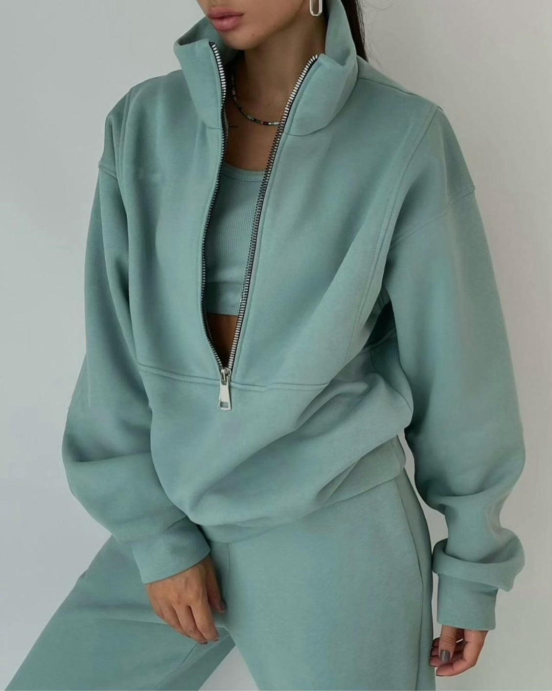 Fashionable women's casual oversized two-piece lounge set in a neutral tone, ideal for cozy everyday style.