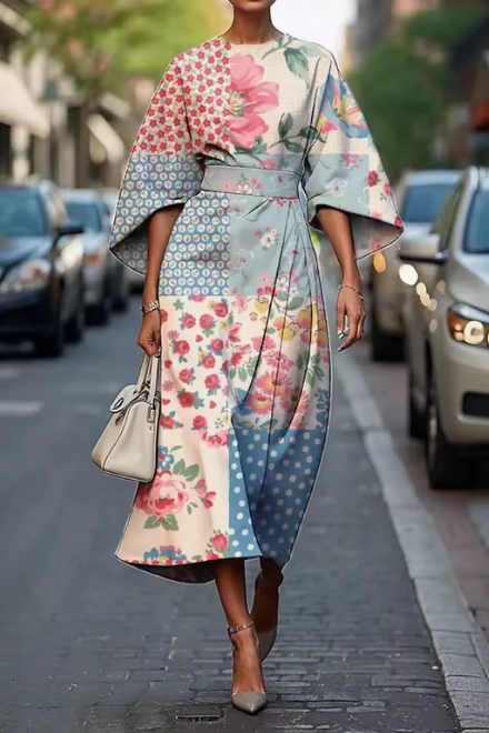 Vibrant painterly floral A-line midi dress featuring chic puff sleeves, a perfect statement for women's fashion.