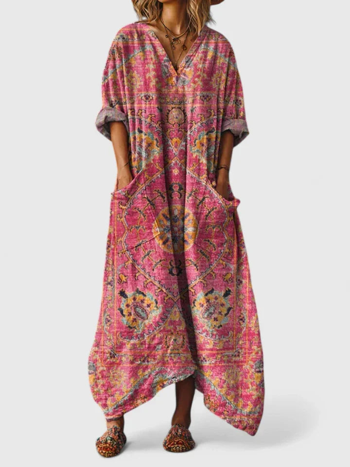 Vibrant paisley print women's maxi dress. Oversized, flowy silhouette with V-neck for a chic bohemian look.