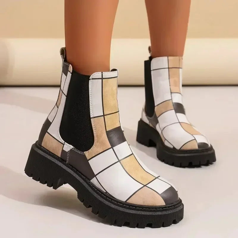 Close-up of women's patchwork ankle boots, highlighting the varied textile craftsmanship and lug sole.