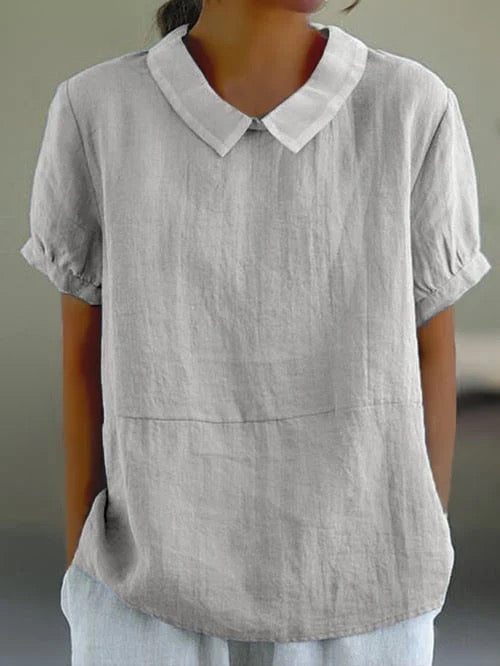 Women's casual blouse featuring a chic Peter Pan collar, relaxed fit, and short sleeves for summer.