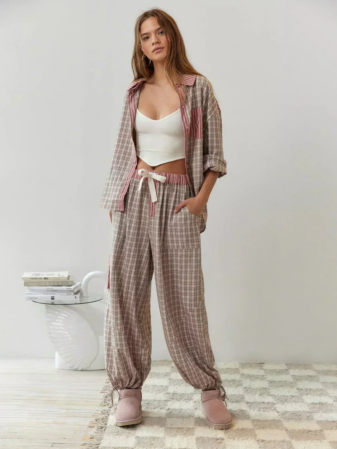 Woman wearing a blue plaid matching set, standing, perfect for casual spring wear