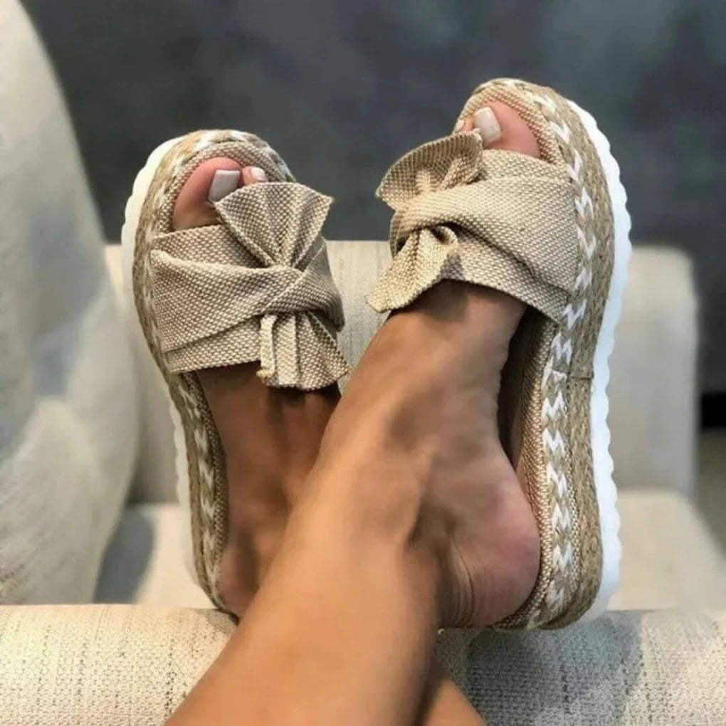 Women's pink platform bow slide sandals, perfect for summer casual wear.