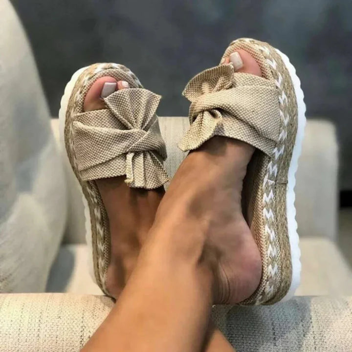 Women's pink platform bow slide sandals, perfect for summer casual wear.
