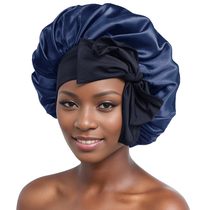 Close-up of the smooth, shiny silk satin fabric of a women's sleep bonnet in silver